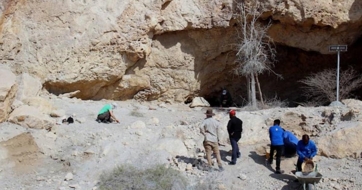 Researchers at Jabal Kaf Addor rock shelter in the Al Habhab region, UAE.  	Source: Fujairah Tourism & Antiquities Authority