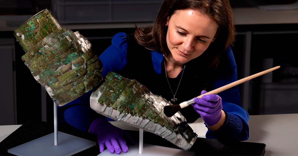 Conservator Bethan Bryan with the Roman arm guard. Source: Duncan McGlynn / National Museums Scotland