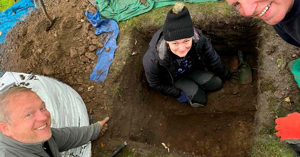 Dr Murray Cook (bottom left) and other members of the dig with the remains of the ancient Roman Road in Stirling, Scotland. Source: Stirling Council