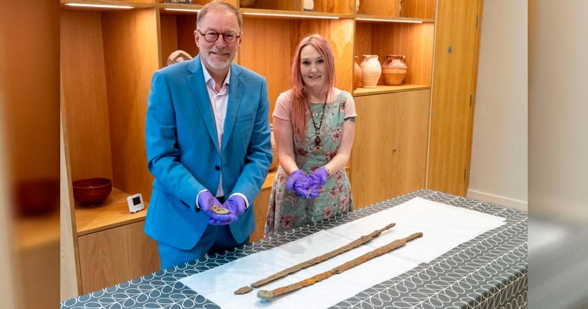 Cllr Paul Hodgkinson, Cotswold District Council Cabinet Member for Leisure, Culture and Health and Emma Stuart, Corinium Museum Director. Proudly exhibiting the Roman swords recently found during a detectorist rally. Source: Cotswold district Council