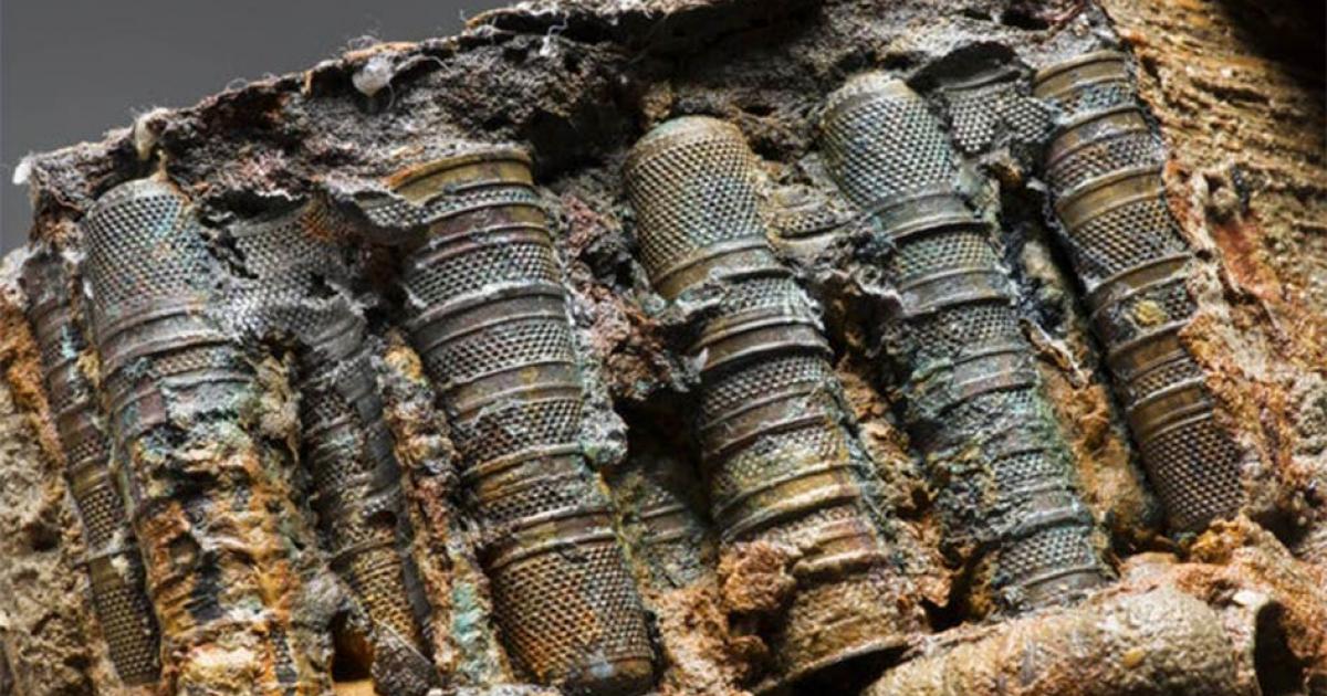 Close up of a selection of the thimbles found among the mysterious artifacts on the Rooswijk shipwreck. The concretions around the artifacts is holding the thimbles together in these straight rows.      Source: © Rijksdienst voor het Cultureel Erfgoed / Historic England