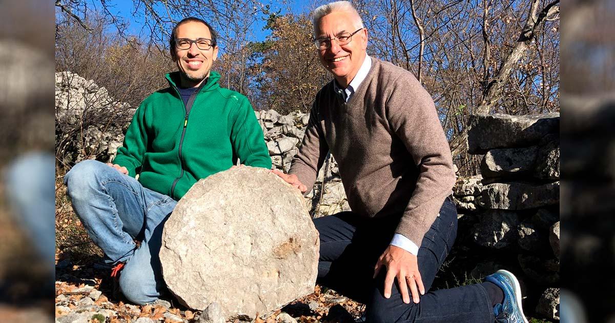 (Left to Right), archaeologist Federico Bernardini and astronomer Paolo Molaro at Castelliere di Rupinpiccolo, holding what could be the oldest celestial map ever discovered. Source: INAF