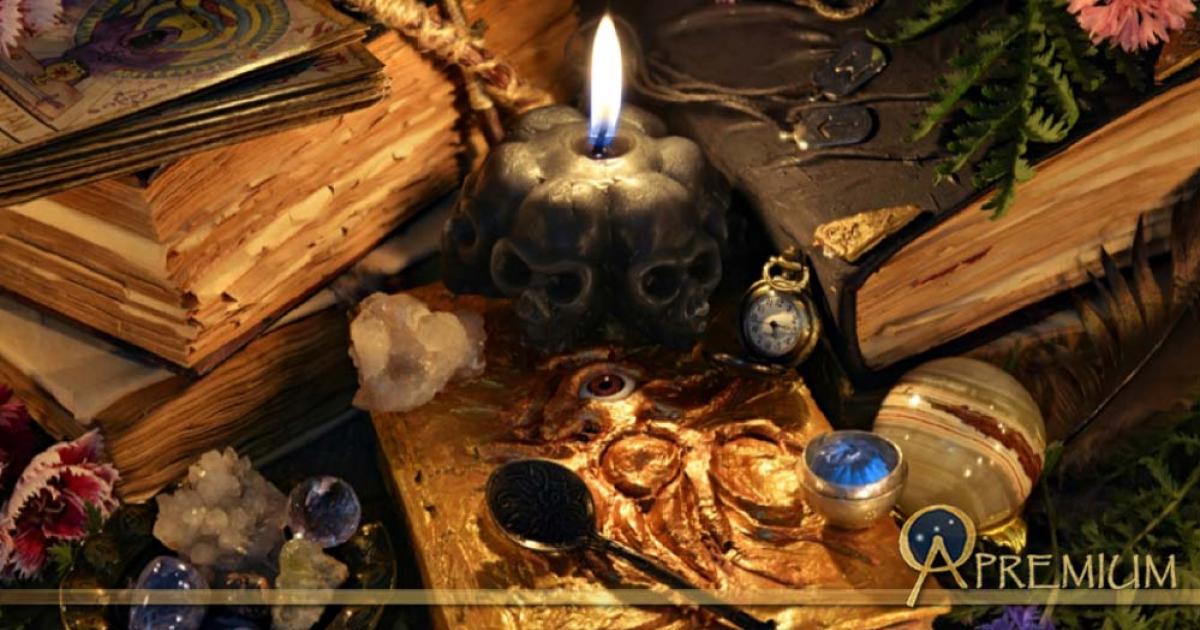 Ancient Sorcery: Antique witch book, black candle and ritual objects.