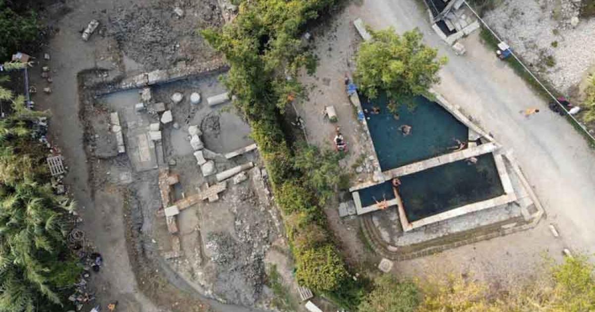 The San Casciano dei Bagni ancient Roman bath site (left), next to the modern baths.