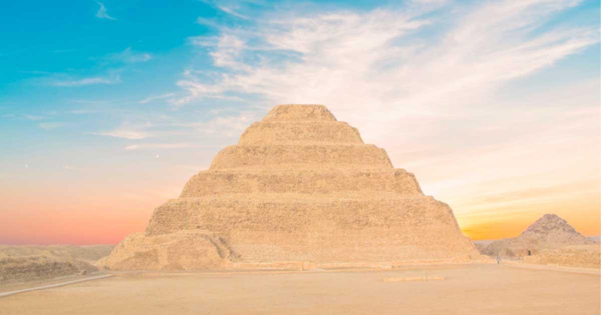 The Pyramid of Djoser looms above the desert landscape in Saqqara necropolis, ancient burial ground of the elite. Source: marinadatsenko / Adobe Stock