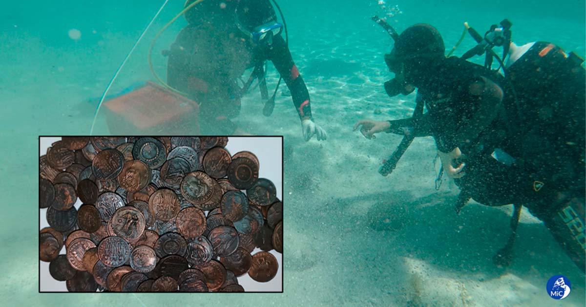 Divers investigating the coin discovery off the coast of Sardinia. Credit: Italy’s Culture Ministry.