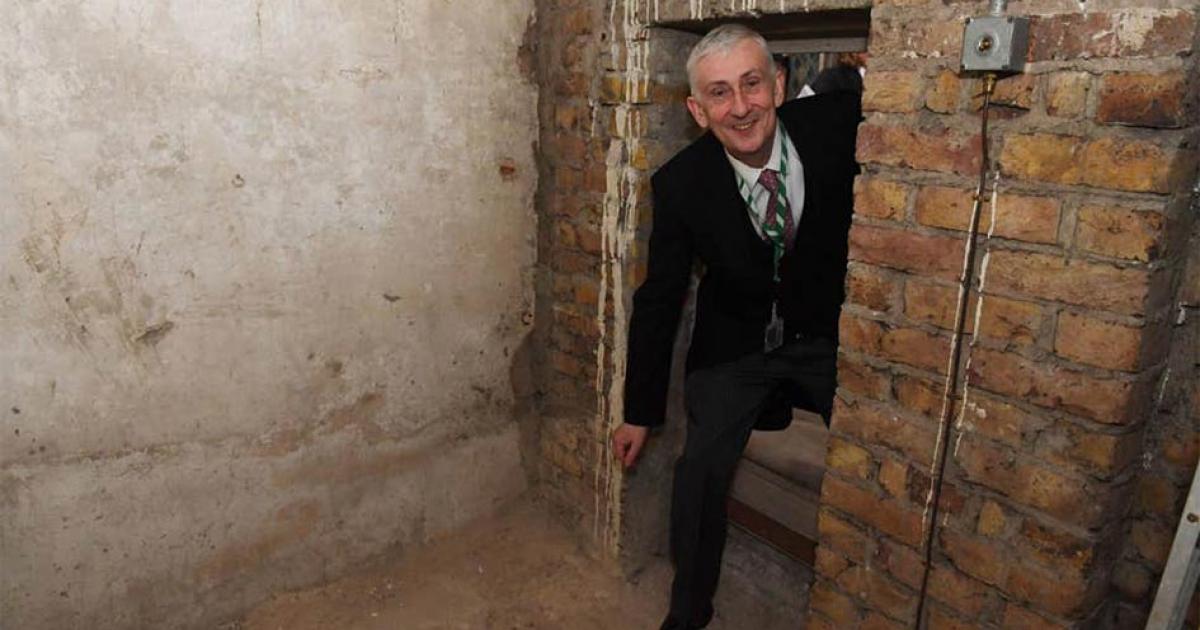 Sir Lindsay Hoyle, Speaker of the House of Commons, poses inside the newly-rediscovered secret passage.       Source: Jessica Taylor / UK Parliament