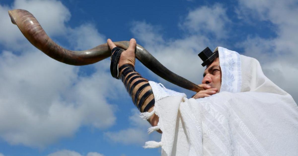 A shofar is sounded under the light of the sun. Source: Rafael Ben-Ari /Adobe Stock.