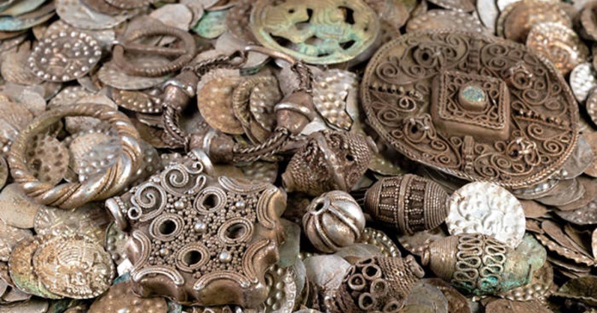 Selection of silver coins, jewelry, and pendants from the medieval hoard discovered near Stockholm.