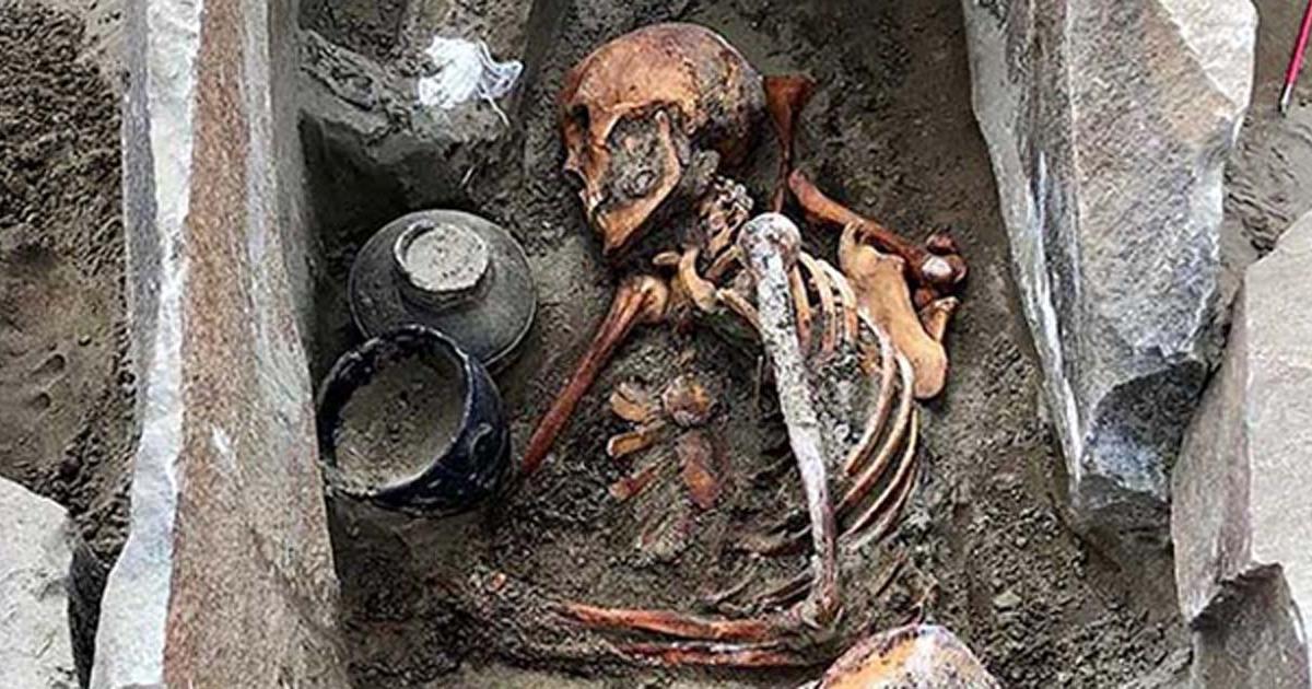 The ancient woman was buried wearing a silk skirt with a funeral meal.