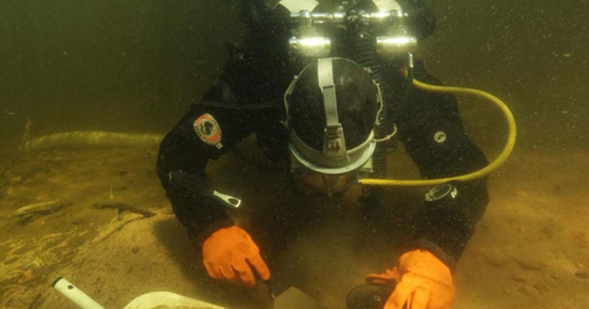 Eveliina Salo taking samples of the hearth structure. 