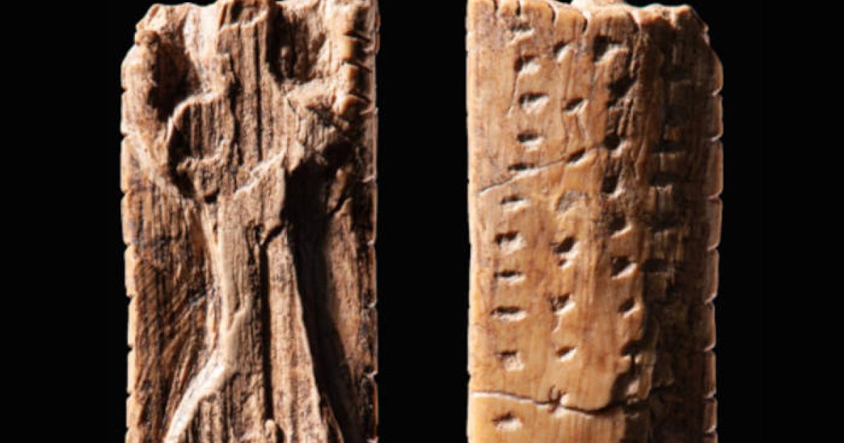 The mammoth figurine from Vogelherd Cave, approximately 40,000 years old, bearing multiple sequences of crosses and dots.