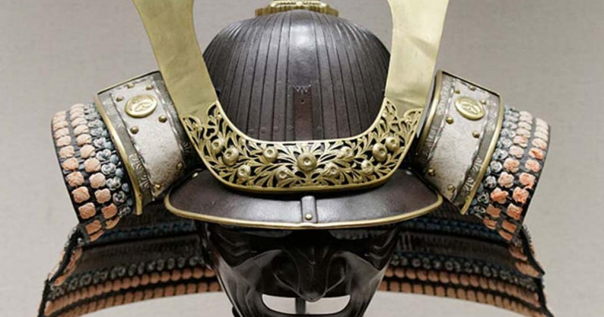 Japanese parade helmet, made from iron, gilded copper, lacquered leather, silk