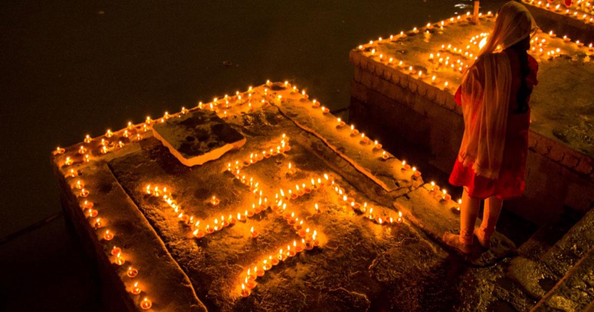 Swastika symbol decoration of clay lamps (diya) in Varanasi, India on the festival of Dev Diwali. Source: ShishirKumar / Adobe Stock