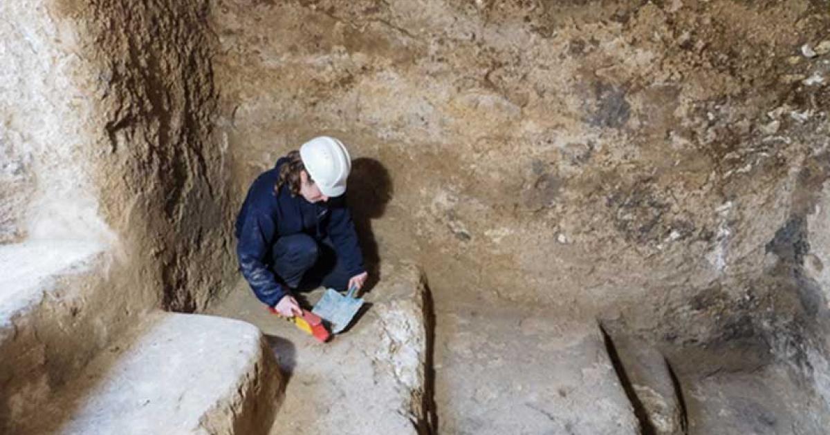 An archaeologist collects material in an underground chamber that may have been a hideout for rebels during the Bar Kokhba Revolt of the 2nd century AD. 