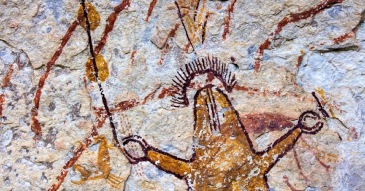 Ancient polychromatic Pecos River style rock art mural showing humanlike figures with elaborate symbolic elements.
