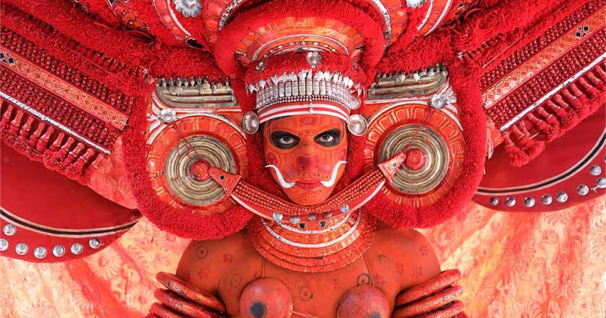 Dancer at a traditional Theyyam ceremony, India. Source: Dietmar Temps / Adobe Stock.