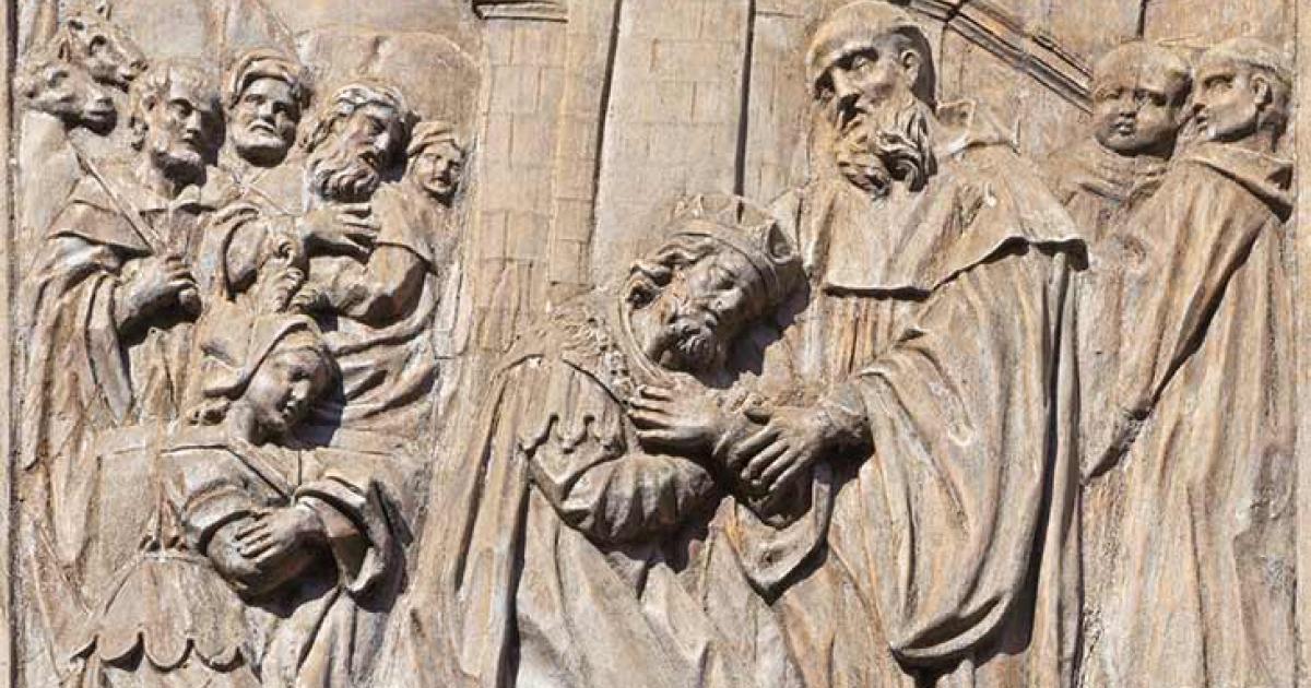A baroque carved relief (at the Church of Saint Benedict in Venice, Italy) from the life of St. Benedict showing Totila, the king of Ostrogoths, on his knees. During the invasion of Italy, Totila ordered a general to wear his kingly robes to see whether St. Benedict would discover the truth. Immediately Benedict detected the impersonation. Impressed, Totila came to pay his respects to the man of the cloth. Totila was the leader of the Ostrogoths in the Third Siege of Rome. Source: Renáta Sedmáková / Adobe S