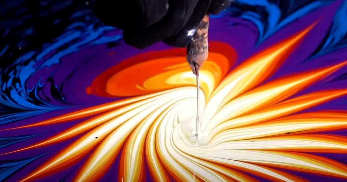 Turkish artist Garip Ay producing ebru water art. Source: YouTube Screenshot / Great Big Story)