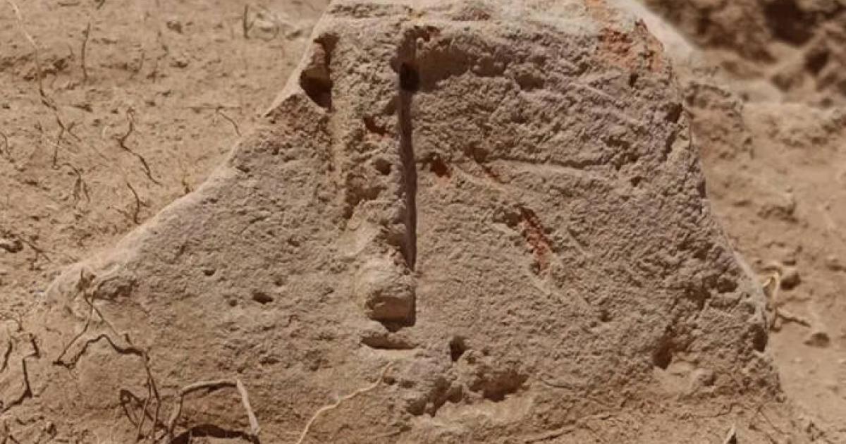 Stone idol with carved human facial features in situ in Armenia.