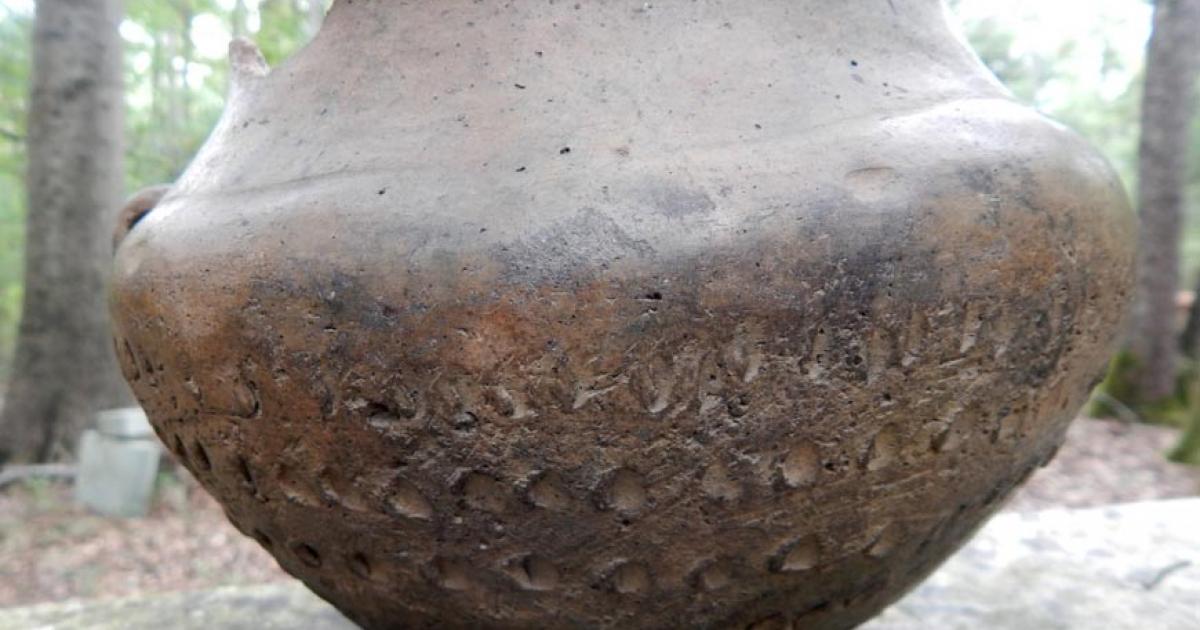 Bronze Age pot of the proto-Celtic Urnfield culture, sporting ritualistic symbols and mathematical markings.
