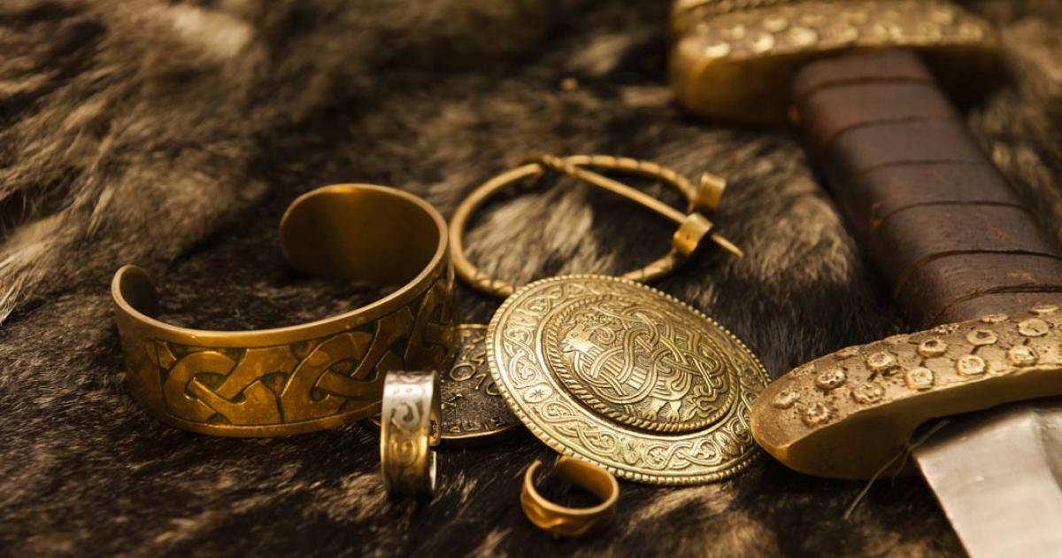 Viking jewelry and sword representations on fur