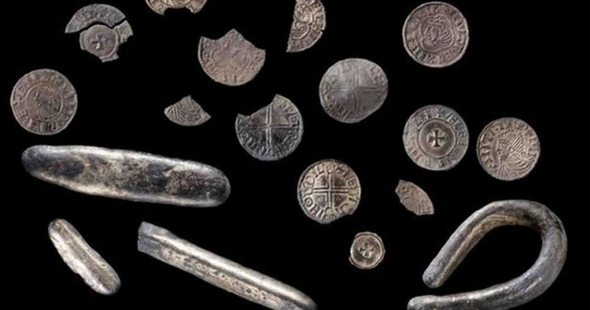 The treasure found by a Welshman with a metal detector includes silver pennies and coin fragments from the time of King Cnut of England and Scandinavia. 