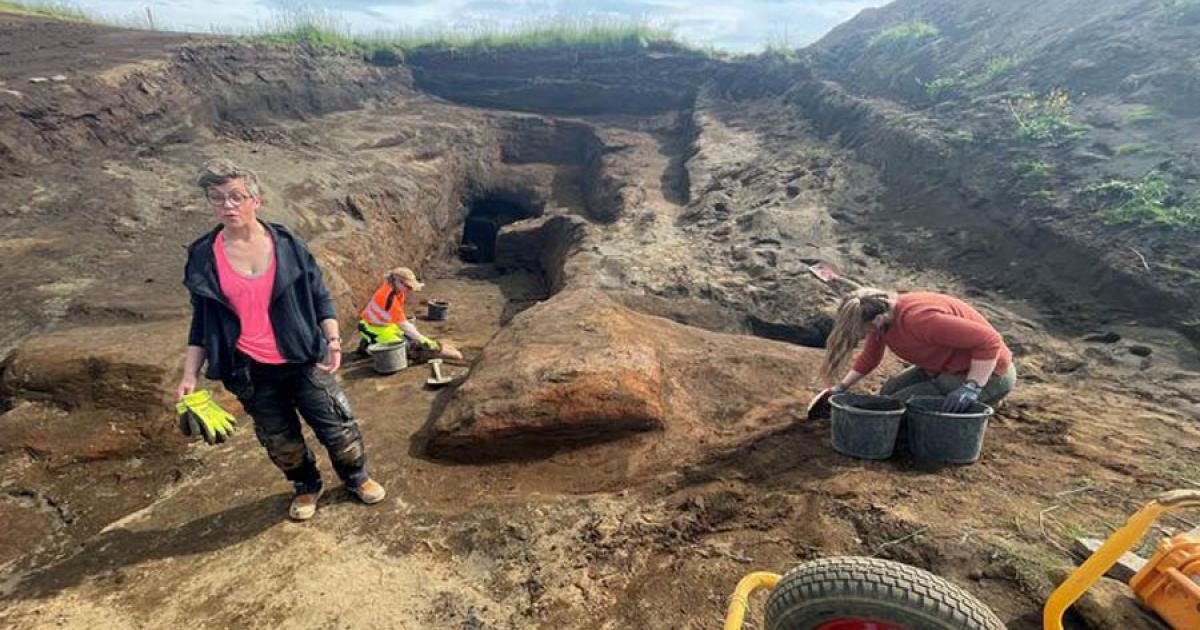 Archaeologist Kristborg Þórsdóttir standing at the site of the vast system of Viking era caves.  Source: Sigurjon Olason / Visir