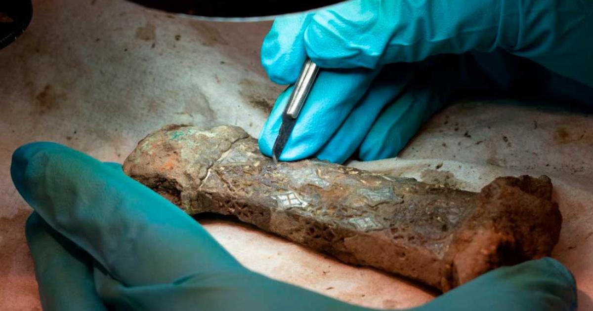 The ornate Viking sword hilt is now pieced back together. Source: Lise Chantrier Aasen/Archeological Museum of Norway