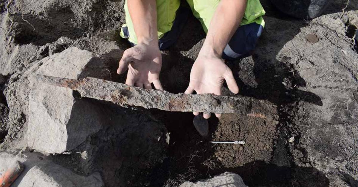 The moment a Viking sword was excavated from a burial mound near Köping, Sweden Source: Arkeologerna Statens historiska museer