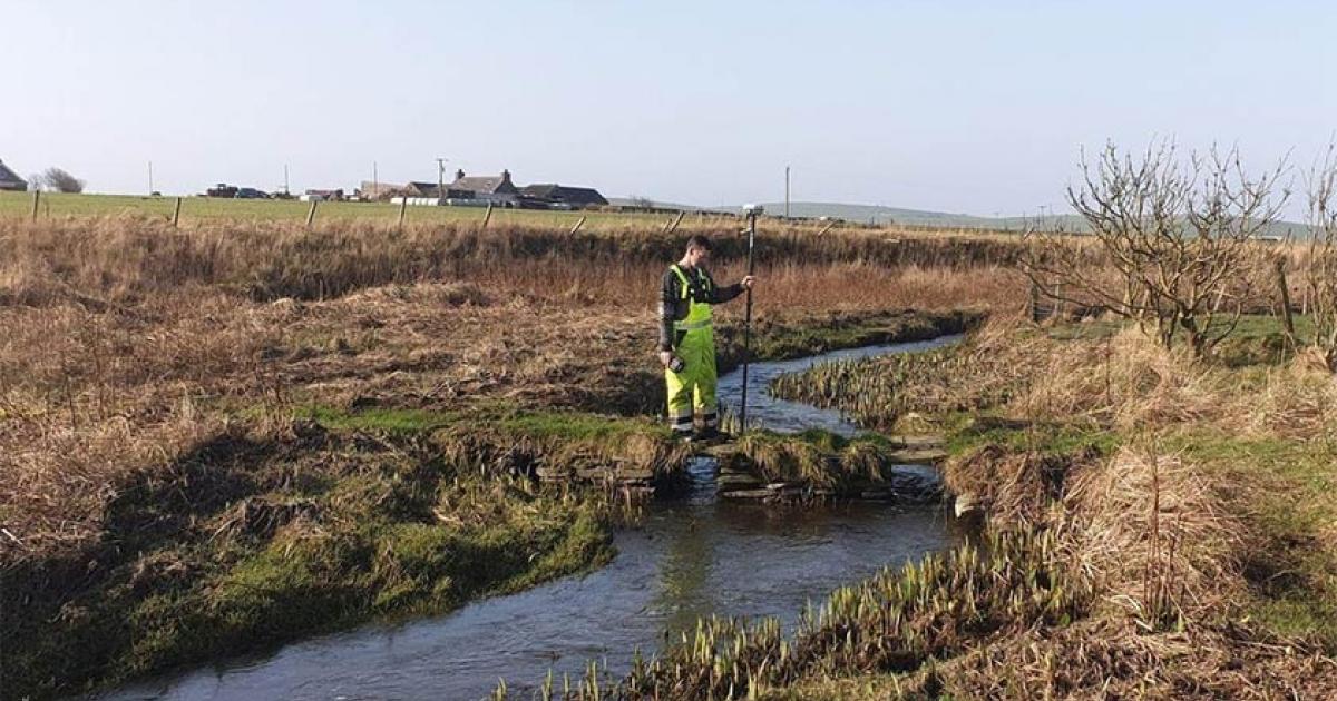Top image: The Orkney River is part of the recently discovered Orkney Viking waterway. The researcher shown in this photo is carrying remote-sensing geophysical mapping equipment.           Source: Express and Star