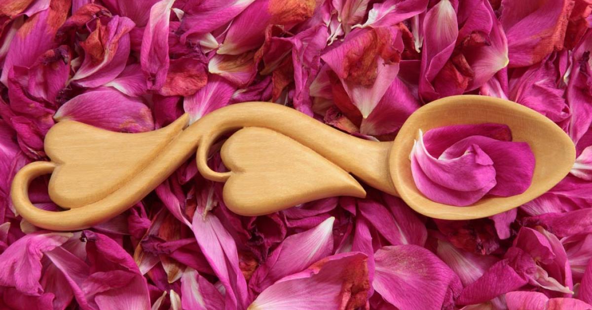 Modern Welsh love spoon on flower petals