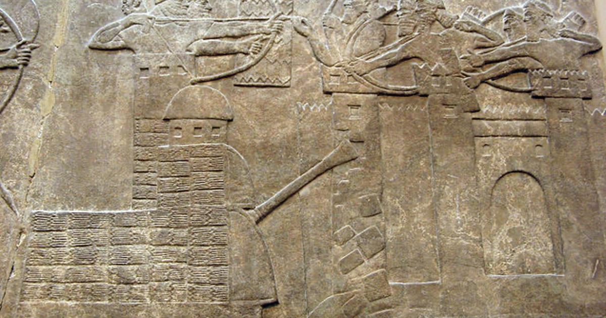 Assyrian attack on a town with archers and a wheeled battering ram, 865–860 BC. 