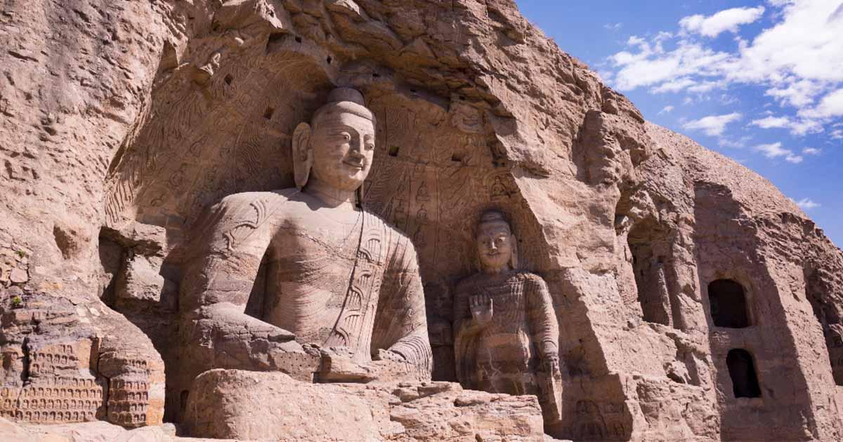 The Yungang Grottoes are a UNESCO World heritage site in Datong, Shanxi province, China. Source: mijun/Adobe Stock