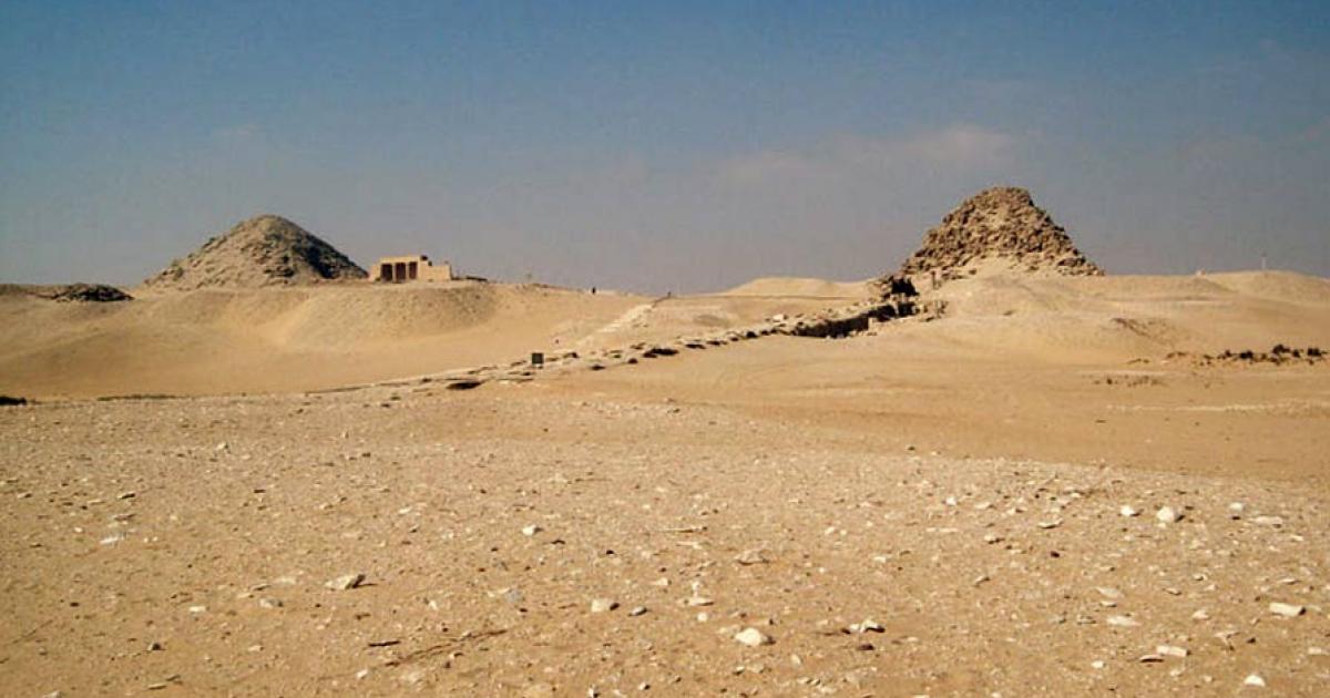 A general view of the ancient Egyptian necropolis at Abu Sir. The pyramid of Sahure is in the forground with the causeway leading up to it. Visible further back is the mastaba of Ptah Shepsus and all the way towards the back is the pyramid of Neferirkare. 