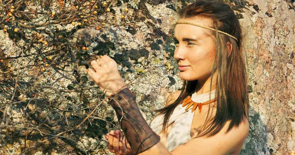 A woman in the hunter-gatherer Stone Age collecting berries, which could be used for medicine or ancient makeup. The oldest ever evidence of makeup was connected to a ceramic object long thought to be a child's toy from 6,000 years ago in Slovenia! 	