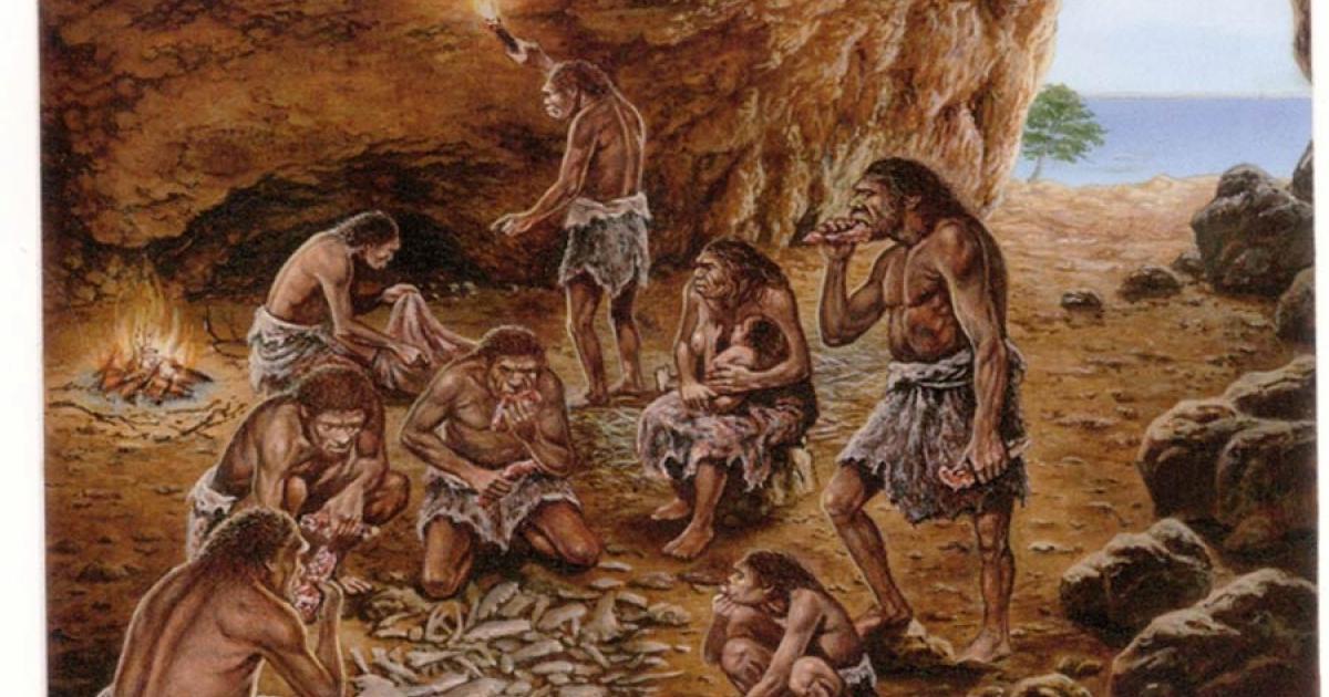 Reconstruction of ancient human cave dweller in the Lazaret Cave, France, showing the hearth at the side of the cave. 	Source: De Lumley, M. A. / Public Domain