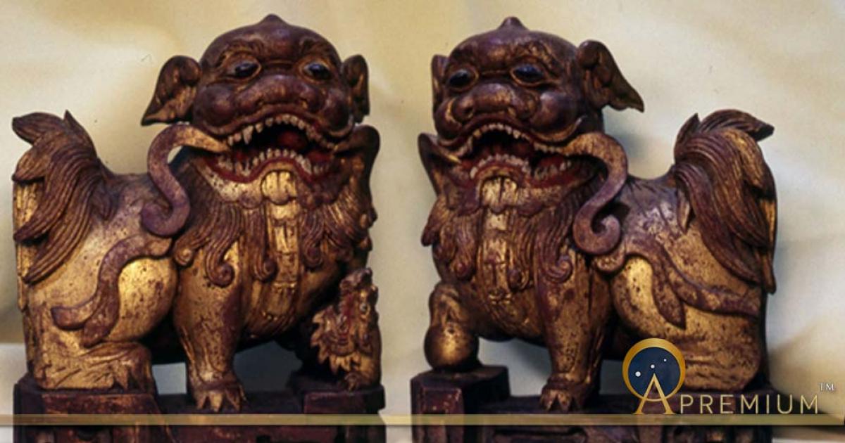 A pair of wooden shiziguo type lions decorated with gilt and polychrome.  The female has a cub, symbolizing a happy family.  Chinese, early Ching Dynasty (Image: © Walther G. von Krenner)