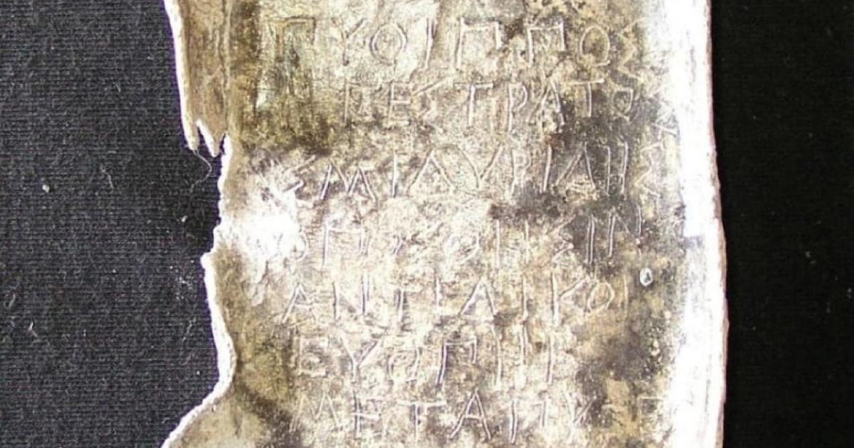 Oval lead ‘coffin’ with a spell against Pytheas, ordered by an Pytheas' opponent in an Athenian law court. Source: Dr. Jutta Stroszeck / German Archaeological Institute.