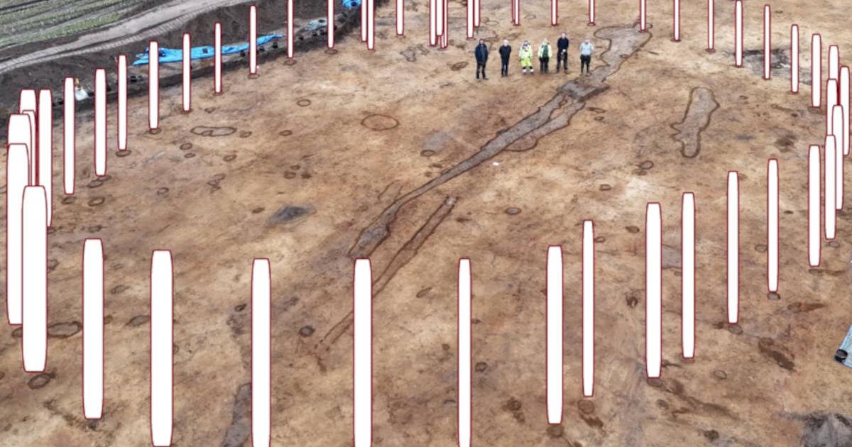 Photo of timber circle site in Denmark, with overlay showing how it would have looked with posts installed 4,000 years ago.
