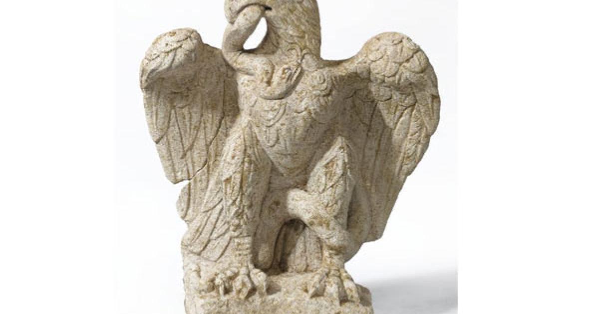 Eagle eating serpent sculpture