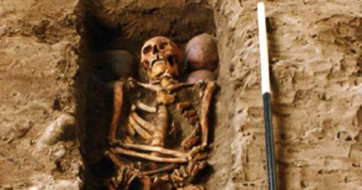 The grave holding one of the skeletons and the four skulls. (FAS Heritage / Fair UseThe reconstructed face of the clansman who was killed in the 15th century. 
