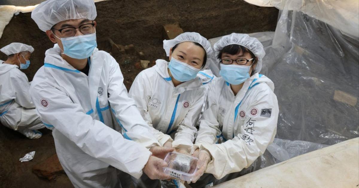 Researcher Li Nan, from Peking University, pictured with her team, holding the foot amputation evidence that was subjected to biomedical analysis. Source: South China Morning Post