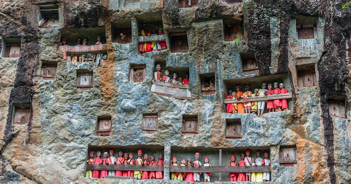 A traditional burial site in Tana Toraja, whose culture is known for elaborate funeral rituals. Source: fabio lamanna / Adobe Stock 