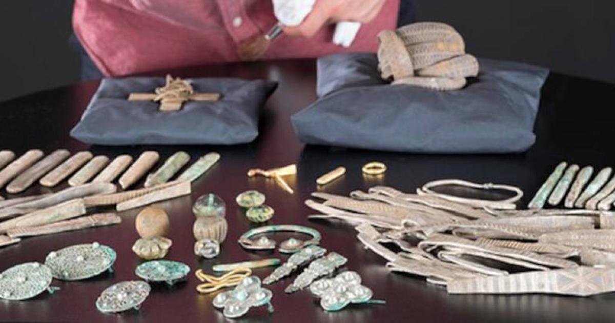 Senior Curator at National Museums Scotland, Martin Goldberg, looking at objects from the Viking age Galloway Hoard.