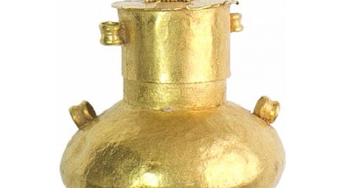 This gold vial may have contained incense. Its contents, which were fossilized, will be analyzed.