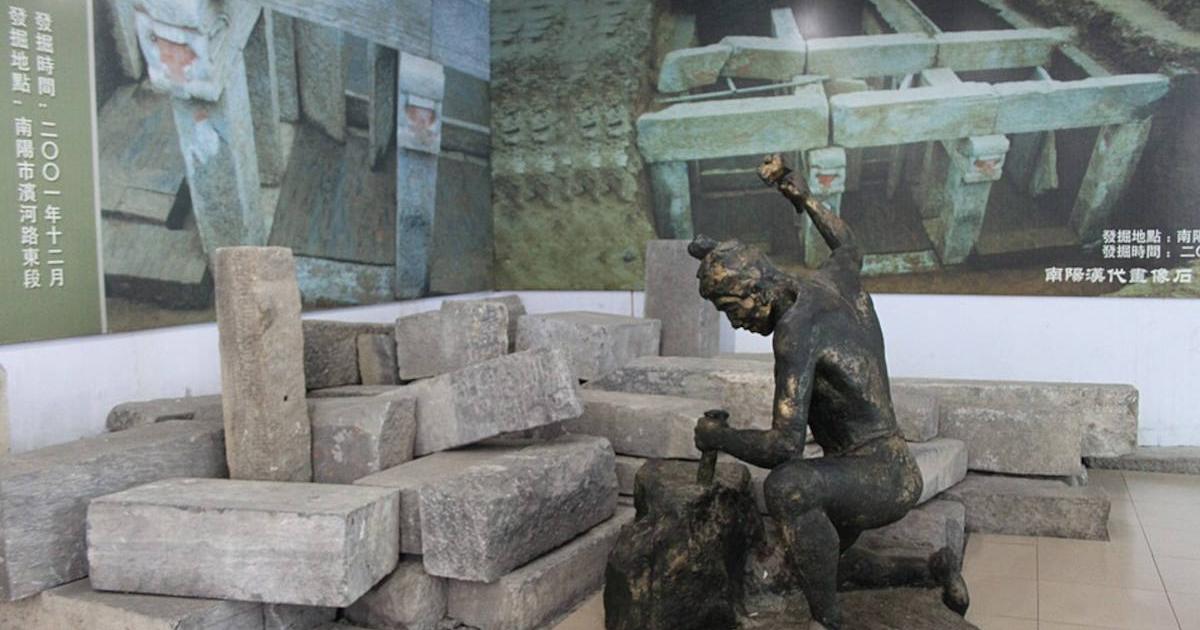 Collection of Han Dynasty tomb bricks, featuring statue of Han stonecutter, on display at Nanyang Museum of Han Dynasty Stone Carving, Henan Province, China