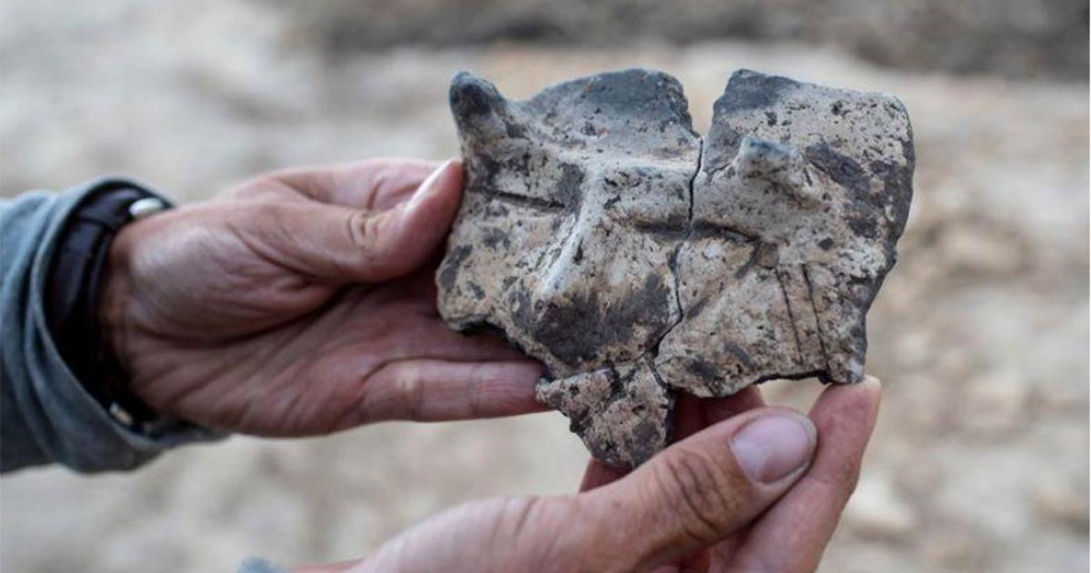 The mysterious ceramic fragment with the horned face image found in a village in Poland.                 Source: Lukasz Gagulski / Science in Poland