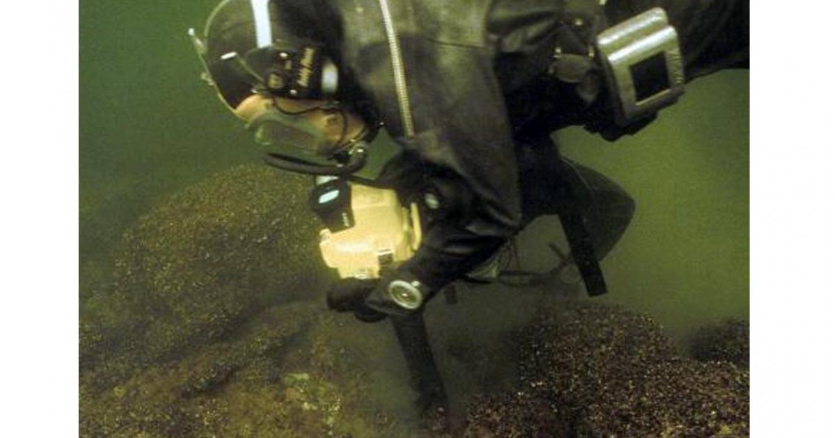 Rauno Koivusaari investigating wreck site. 