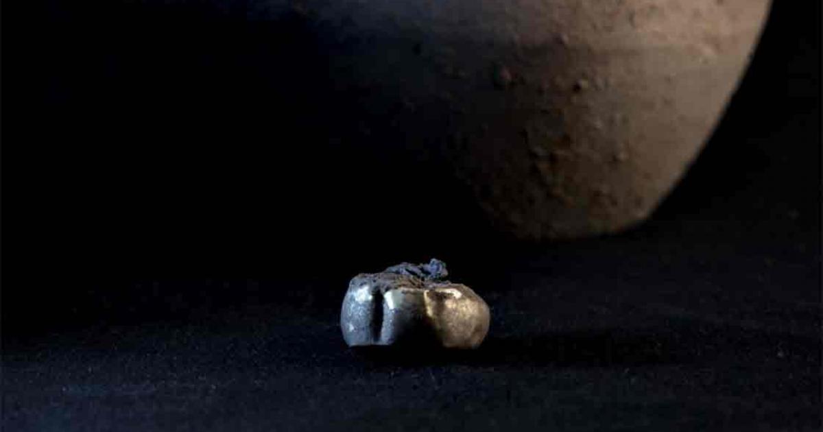 Archaeologists found a gold earring hidden inside a jar that had been placed in a wall at the Iron Age settlement called Tossal de Baltarga. 	Source: Marco Ansaloni/Frontiers